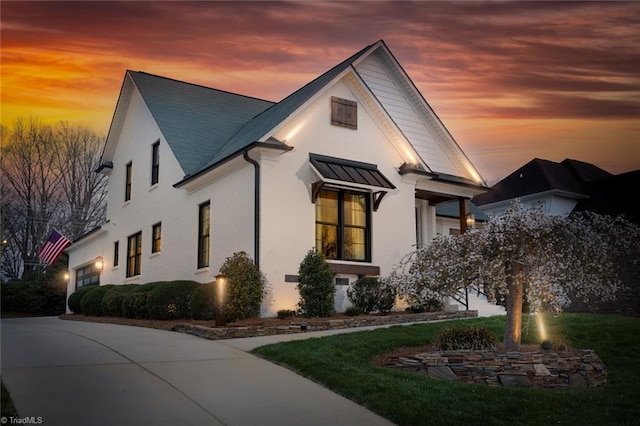 view of property exterior at dusk