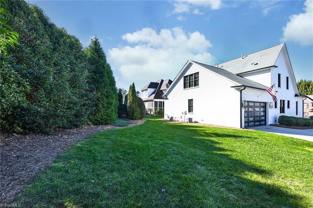 view of side of home featuring a yard