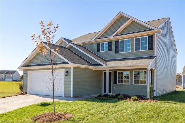 731 Torbay Dr, Mcleansville, NC 27301 - view of front facade with an attached garage, driveway, and a front yard
