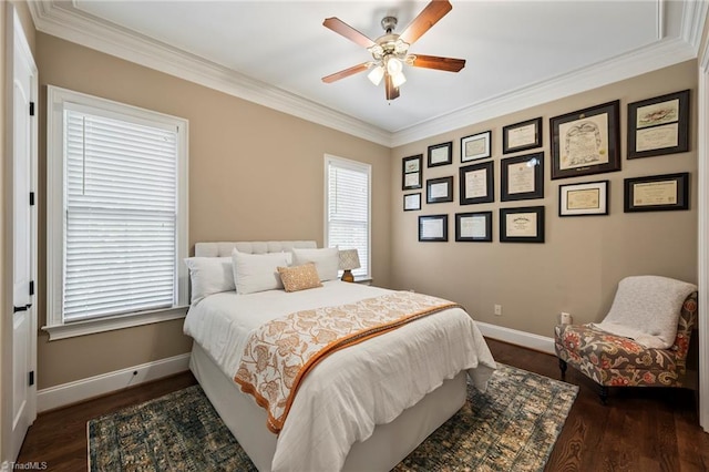 bedroom with a ceiling fan, baseboards, ornamental molding, and wood finished floors