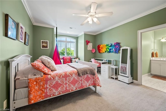 bedroom with visible vents, crown molding, baseboards, connected bathroom, and carpet flooring