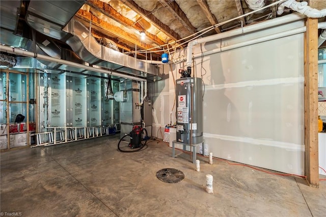unfinished basement featuring gas water heater