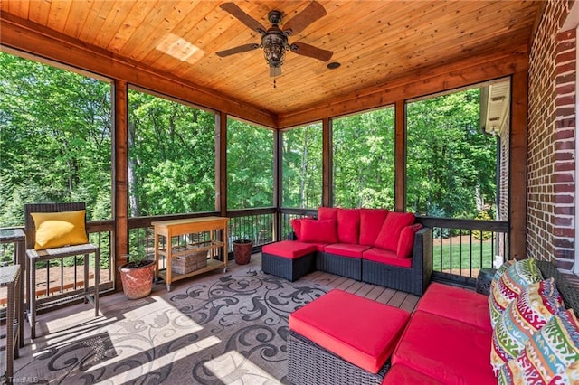 sunroom / solarium with outdoor lounge area and a ceiling fan