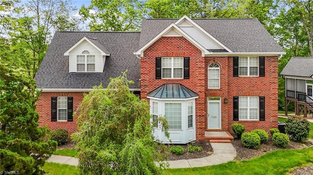 730 Greyrock Rd, Whitsett, NC 27377 - colonial-style house featuring roof with shingles and brick siding