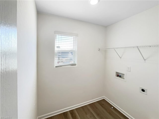 laundry area with hookup for a washing machine, baseboards, laundry area, dark wood-style flooring, and electric dryer hookup