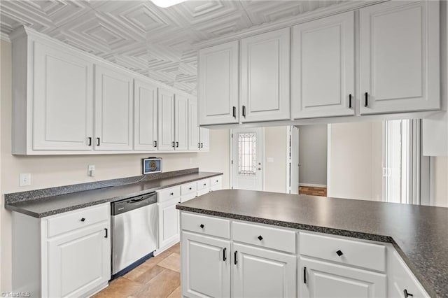 kitchen with white cabinets and stainless steel dishwasher