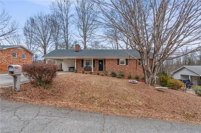 single story home with a carport