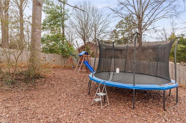 view of jungle gym featuring a trampoline