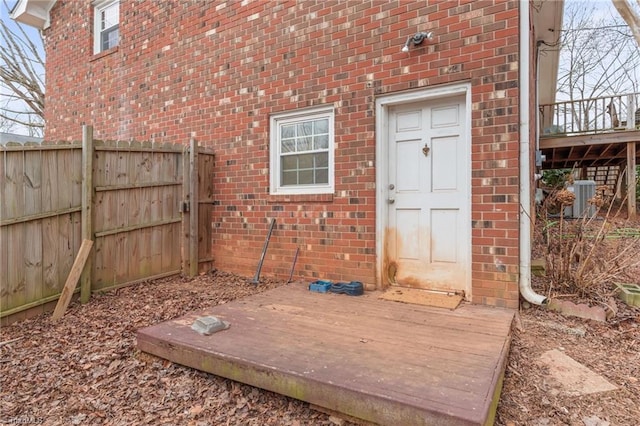 entrance to property with a deck and central AC