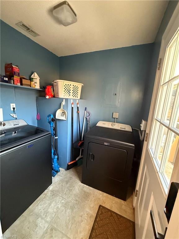 washroom with washing machine and clothes dryer