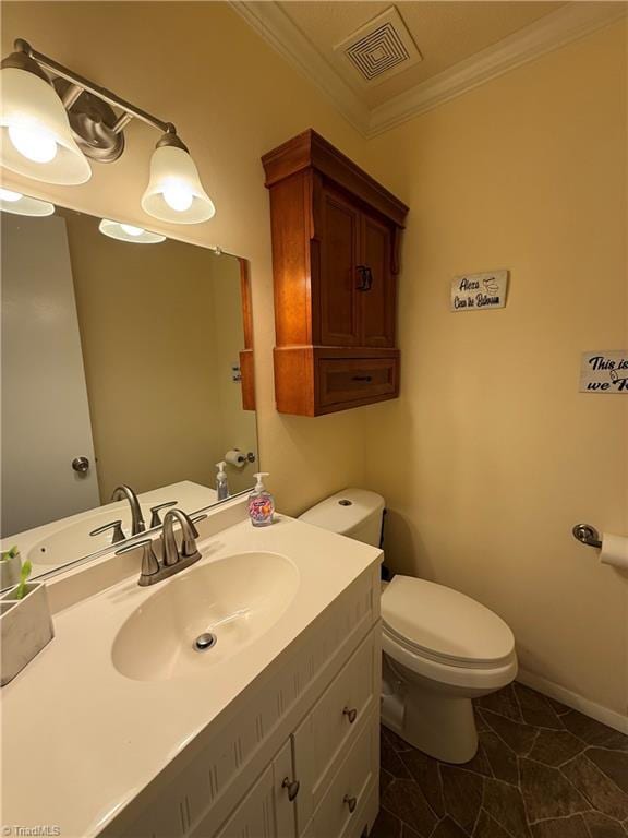 bathroom featuring ornamental molding, toilet, and vanity