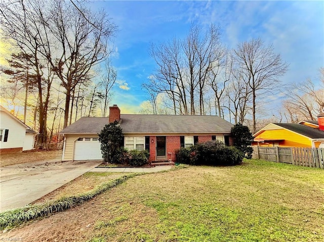 single story home featuring a garage and a front yard