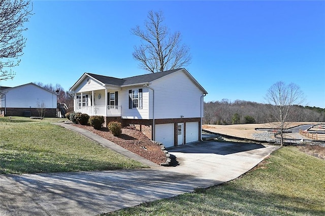 view of front of home with a garage, a porch, concrete driveway, and a front lawn