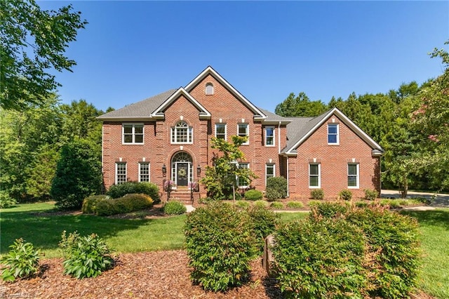 6707 Fegan Rd, Summerfield, NC 27358 - view of front of house featuring brick siding and a front yard