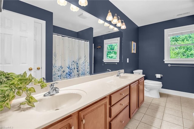 6707 Fegan Rd, Summerfield, NC 27358 - bathroom with double vanity, tile patterned flooring, and a shower with curtain