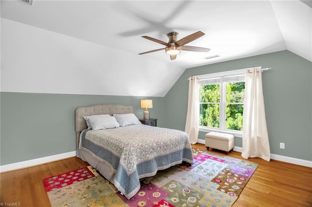 6707 Fegan Rd, Summerfield, NC 27358 - bedroom featuring vaulted ceiling, wood finished floors, and ceiling fan