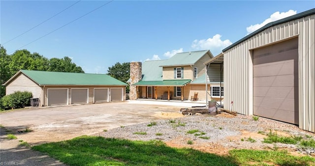 view of yard with an outbuilding and a garage