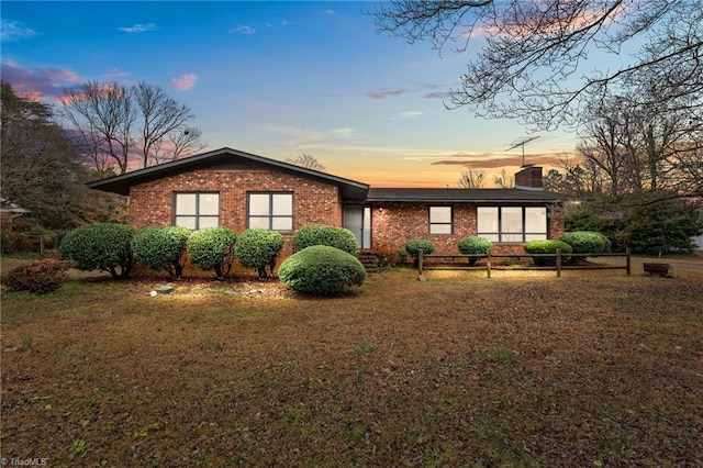 view of front of house with a lawn