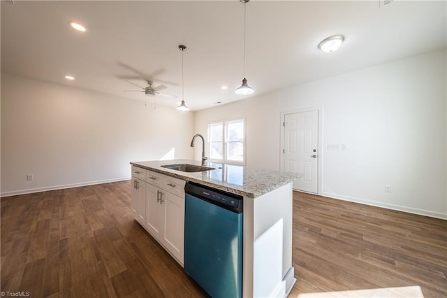 kitchen with pendant lighting, dishwasher, a center island with sink, sink, and white cabinetry