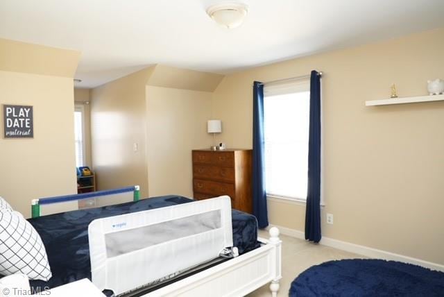 bedroom with lofted ceiling