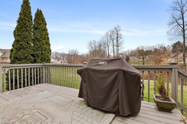 wooden terrace featuring area for grilling