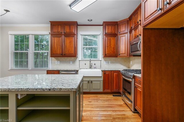 4 Beech Grove Ct, Greensboro, NC 27455 - kitchen featuring open shelves, appliances with stainless steel finishes, a sink, ornamental molding, and light wood finished floors