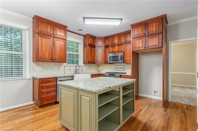 4 Beech Grove Ct, Greensboro, NC 27455 - kitchen with stainless steel appliances, a sink, light wood-style floors, decorative backsplash, and crown molding