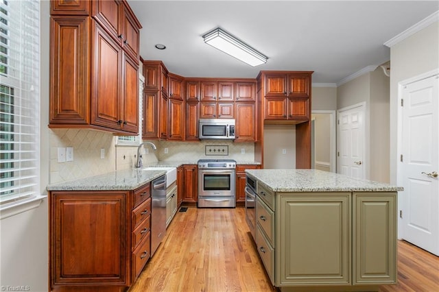 4 Beech Grove Ct, Greensboro, NC 27455 - kitchen with appliances with stainless steel finishes, a sink, light wood-style floors, backsplash, and light stone countertops