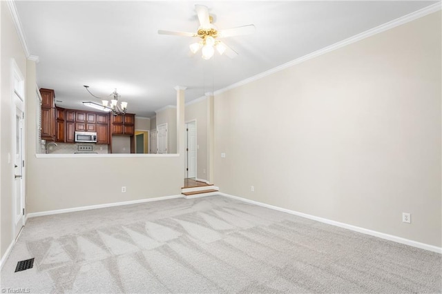 4 Beech Grove Ct, Greensboro, NC 27455 - unfurnished living room featuring crown molding, a chandelier, a ceiling fan, baseboards, and light colored carpet