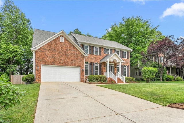 4 Beech Grove Ct, Greensboro, NC 27455 - view of front of property with brick siding, driveway, an attached garage, and a shingled roof