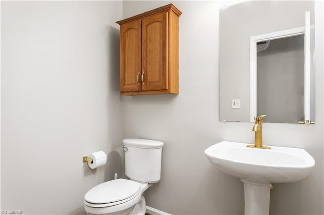 4 Beech Grove Ct, Greensboro, NC 27455 - half bathroom with toilet, baseboards, and a sink