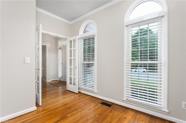 4 Beech Grove Ct, Greensboro, NC 27455 - unfurnished room featuring french doors, ornamental molding, wood finished floors, and baseboards