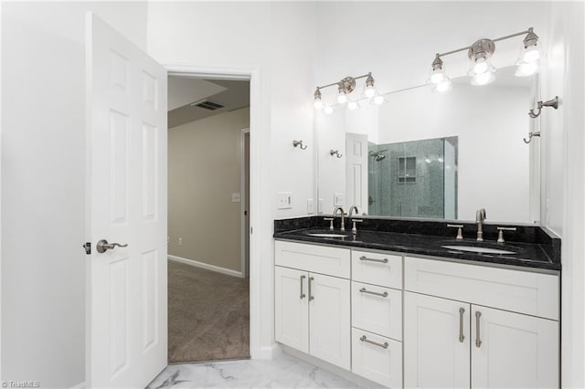 4 Beech Grove Ct, Greensboro, NC 27455 - bathroom with a stall shower, double vanity, marble look tiles, and baseboards