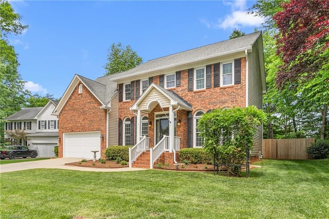 4 Beech Grove Ct, Greensboro, NC 27455 - view of front of property with concrete driveway, brick siding, and a garage