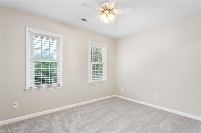 4 Beech Grove Ct, Greensboro, NC 27455 - carpeted empty room featuring healthy amount of natural light, baseboards, and ceiling fan
