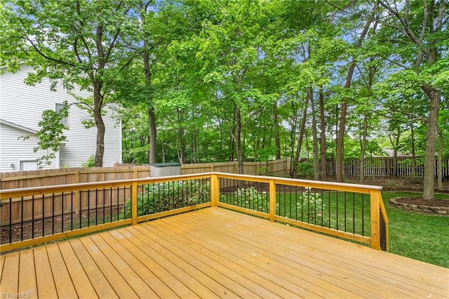 4 Beech Grove Ct, Greensboro, NC 27455 - wooden terrace with a fenced backyard, a storage shed, and an outbuilding