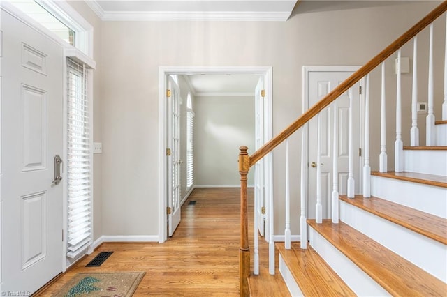 4 Beech Grove Ct, Greensboro, NC 27455 - foyer entrance featuring stairway, crown molding, light wood-type flooring, and baseboards
