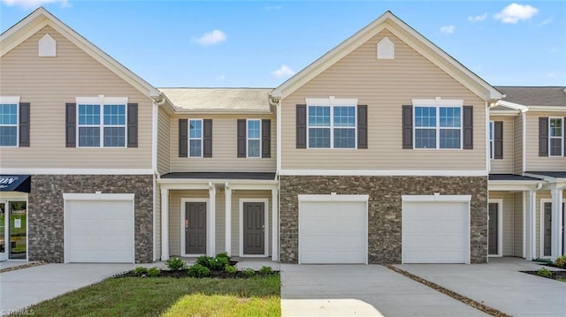 townhome / multi-family property featuring a garage