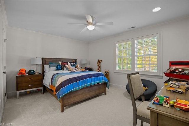 carpeted bedroom with baseboards, visible vents, ceiling fan, and crown molding