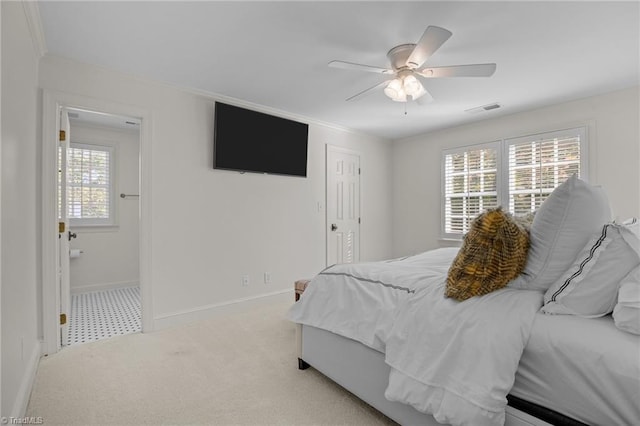 bedroom with crown molding, carpet flooring, visible vents, ceiling fan, and baseboards