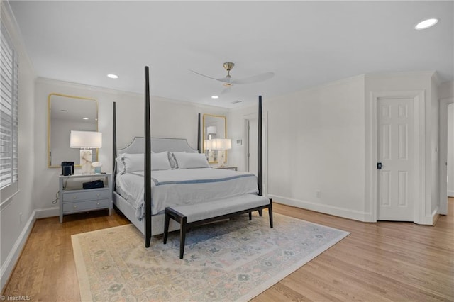 bedroom featuring crown molding, wood finished floors, and baseboards