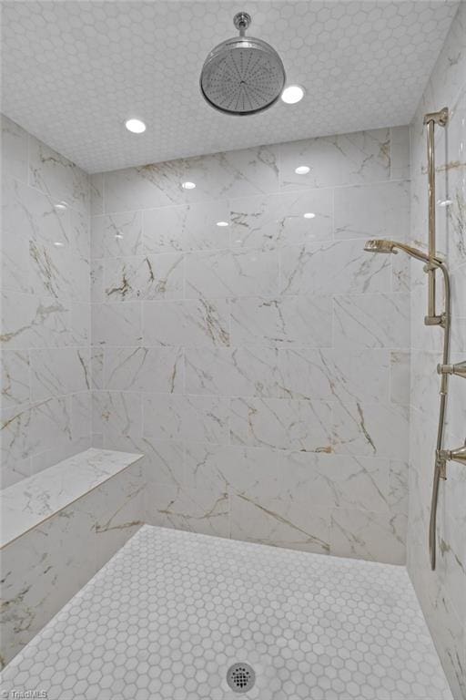 full bath with recessed lighting and a tile shower