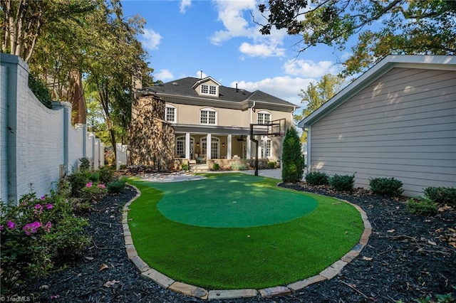 view of yard with a balcony