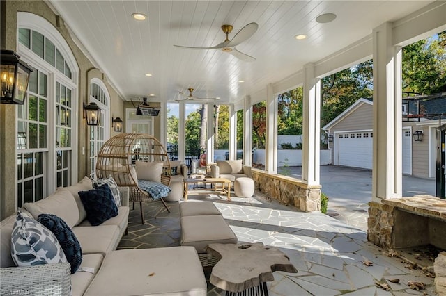 sunroom / solarium with a ceiling fan, recessed lighting, and wooden ceiling