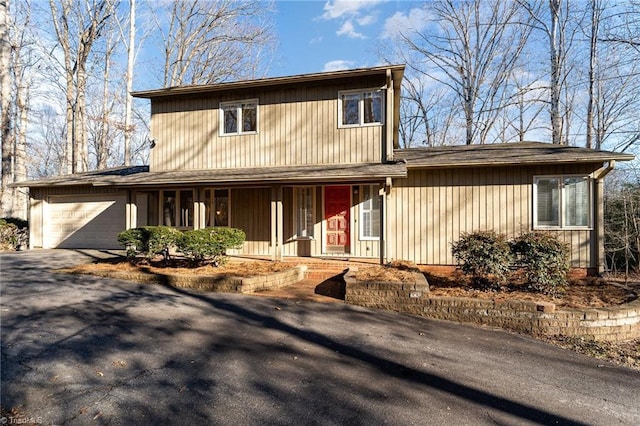 view of front of property featuring a porch and a garage