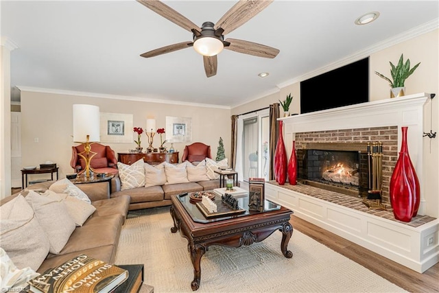 1312 Gilbrook Ct, High Point, NC 27262 - living room with ceiling fan, light wood-style floors, ornamental molding, a brick fireplace, and recessed lighting