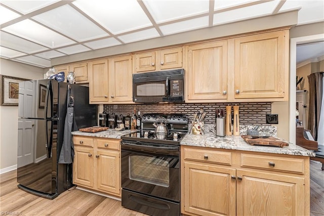 1312 Gilbrook Ct, High Point, NC 27262 - kitchen with black appliances, backsplash, light wood-style floors, light brown cabinets, and light stone countertops