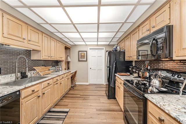 1312 Gilbrook Ct, High Point, NC 27262 - kitchen with black appliances, a sink, and light brown cabinetry