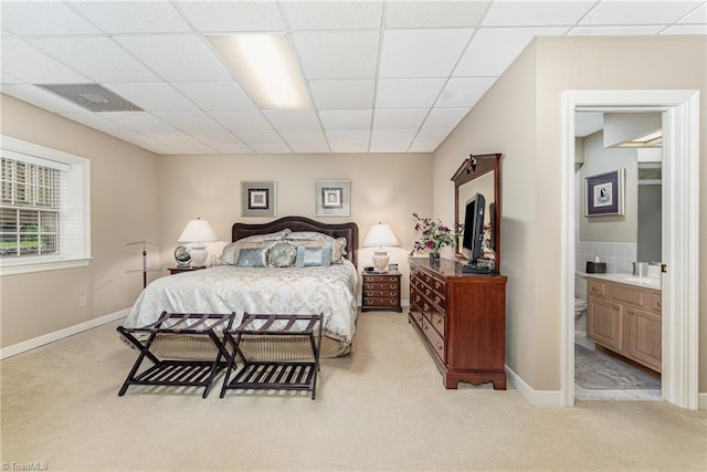 1312 Gilbrook Ct, High Point, NC 27262 - bedroom with light colored carpet, a drop ceiling, ensuite bathroom, and baseboards