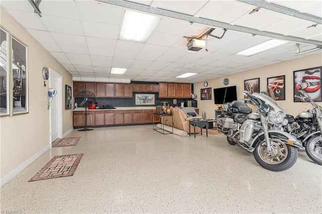1312 Gilbrook Ct, High Point, NC 27262 - garage with baseboards and a garage door opener